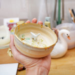 Small ceramic aquarium with a porcelain dinosaur