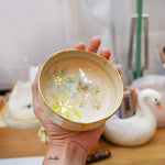 Small ceramic aquarium with a porcelain dinosaur