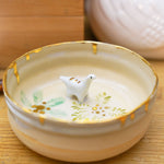 Small ceramic aquarium with a porcelain dinosaur