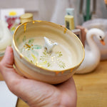 Small ceramic aquarium with a porcelain dinosaur