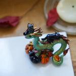 Dragon with black cats figurine