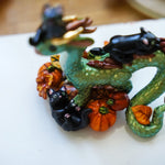 Dragon with black cats figurine