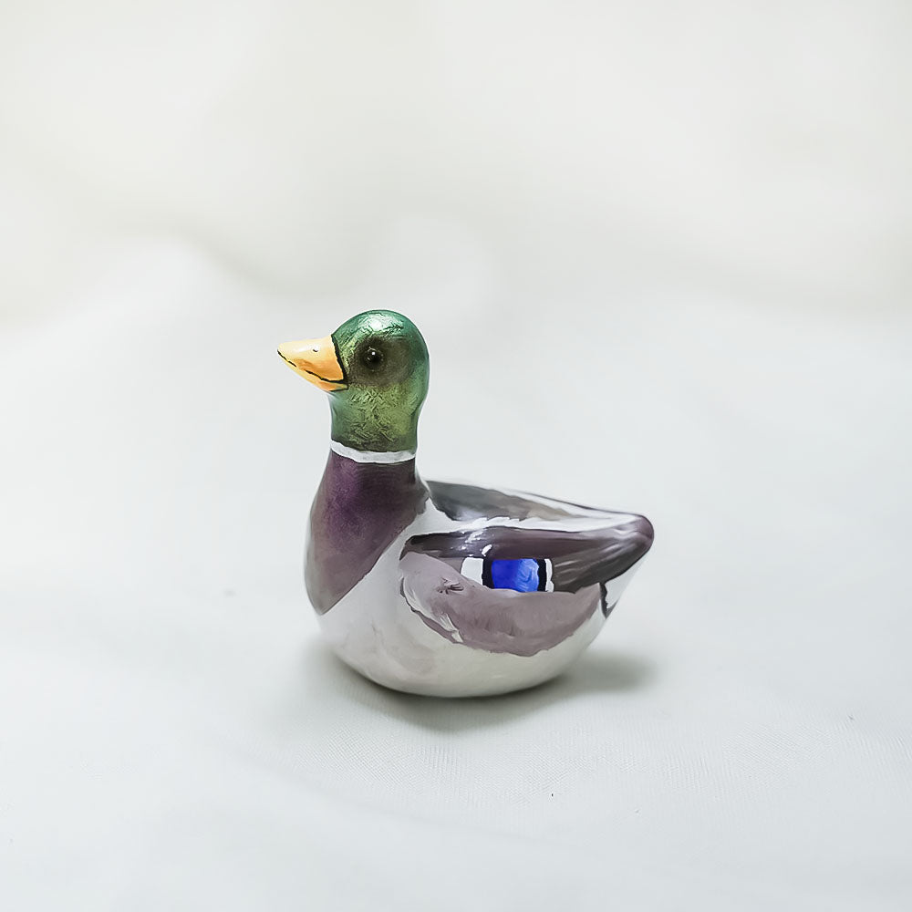 Duck with hats (frog and flowers) figurine