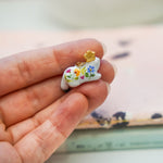 Ermine with a gold star pendant