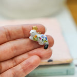 Ermine with a gold star pendant