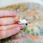 Ermine with a gold star pendant