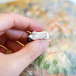 Ermine with a gold star pendant