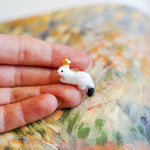 Ermine with a gold star pendant