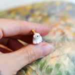 Ermine with a gold star pendant