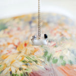 Ermine with a silver star pendant