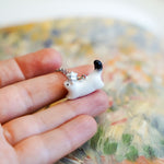 Ermine with a silver star pendant