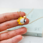 Butterfly fish with a star pendant