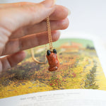 Fox with a star and a fern pendant