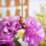 Jumping fox with flowers pendant