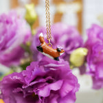 Jumping fox with flowers pendant