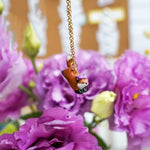 Jumping fox with flowers pendant