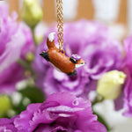 Jumping fox with flowers pendant