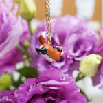 Jumping fox with flowers pendant