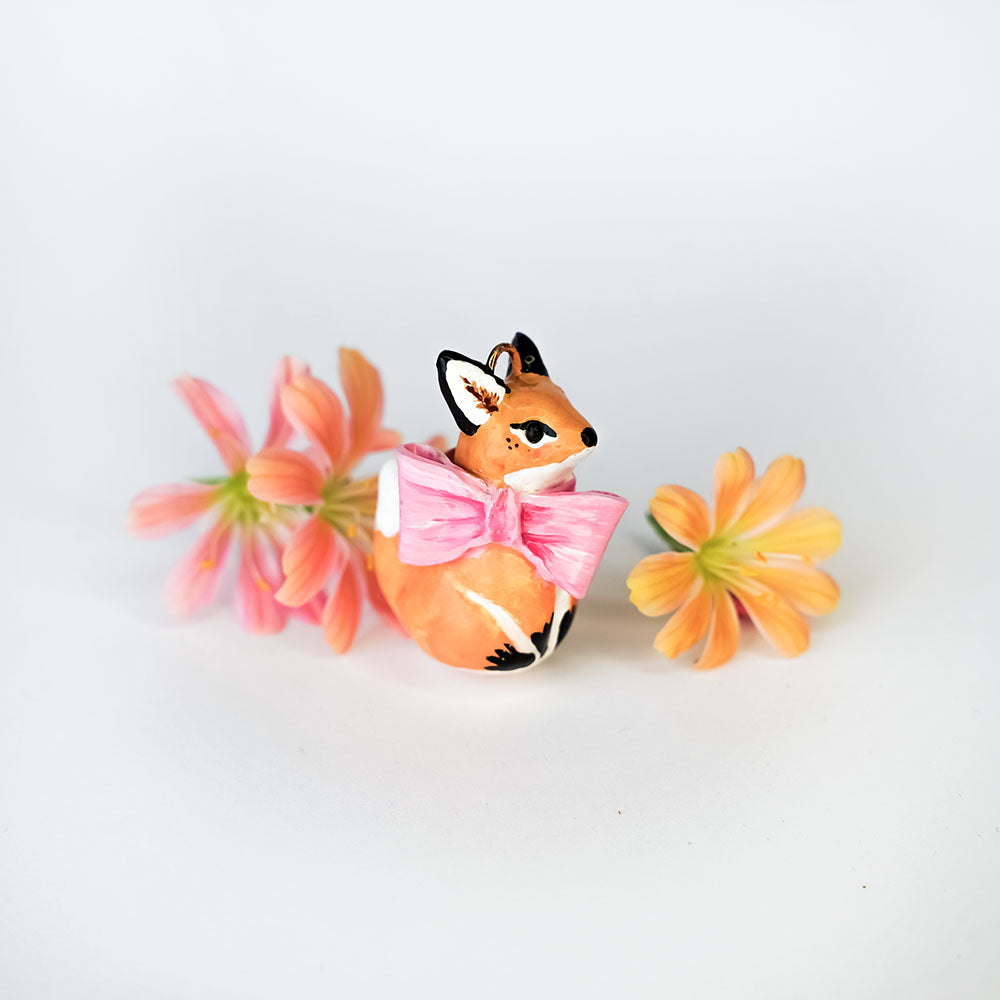 Fox with a pink bow