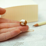 Sitting fox with a star pendant