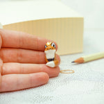 Sitting fox with a star pendant