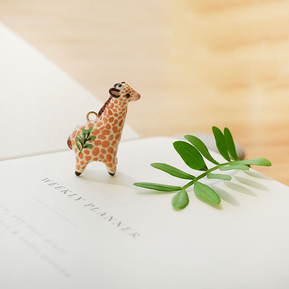 Giraffe with leaf pendant
