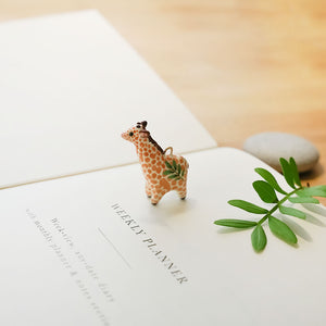 Giraffe with leaf pendant
