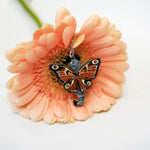 Grey and white cat with butterfly wings pendant
