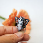 Grey and white cat with butterfly wings pendant