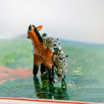 Przewalski horse with baby snow leopards figurine