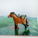 Przewalski horse with baby snow leopards figurine