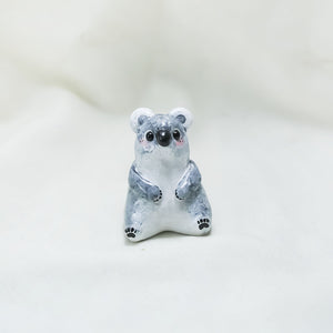 Koala with hats (pig and octopus) figurine