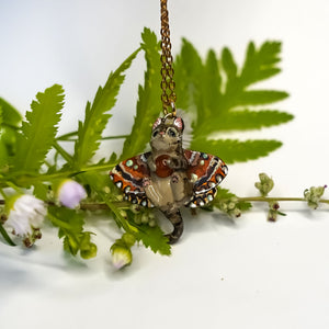 Tabby cat with a carnelian and wings pendant