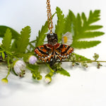 Tabby cat with a carnelian and wings pendant