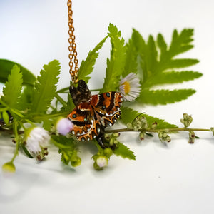 Tabby cat with a carnelian and wings pendant