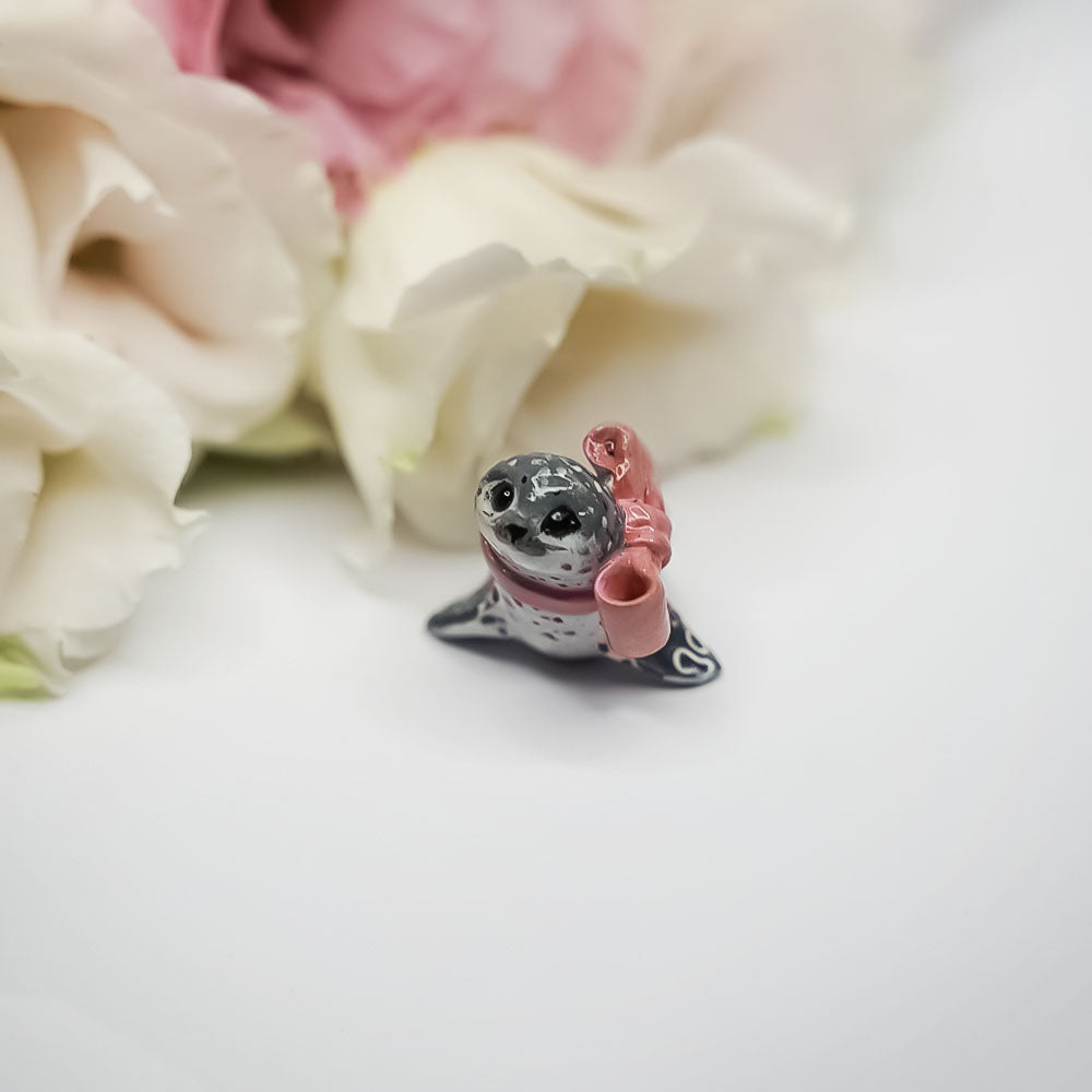 Seal with a pink bow