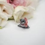 Seal with a pink bow