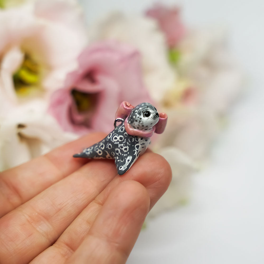 Seal with a pink bow
