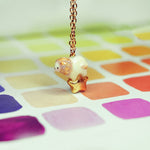 Lion with a star pendant