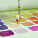 Lion with a star pendant