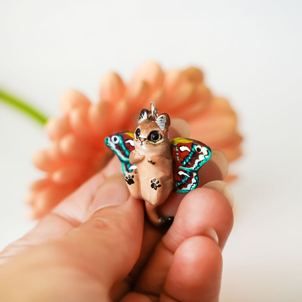 Lioness with moth wings pendant