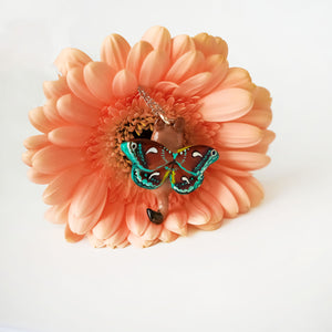 Lioness with moth wings pendant