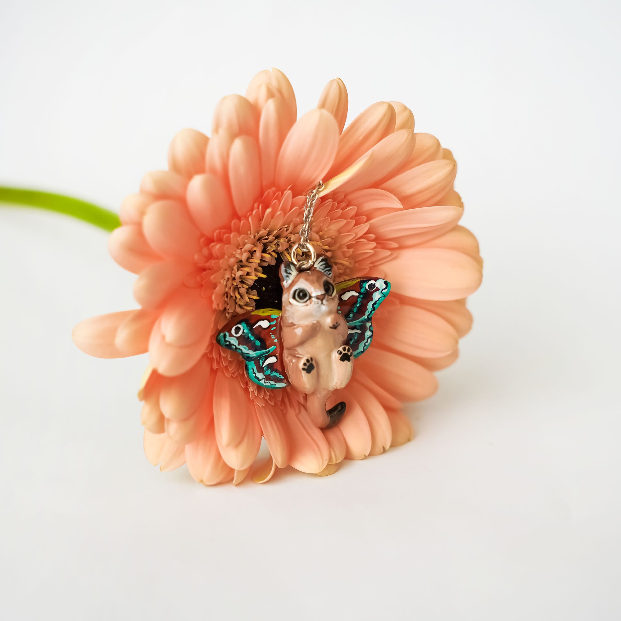 Lioness with moth wings pendant
