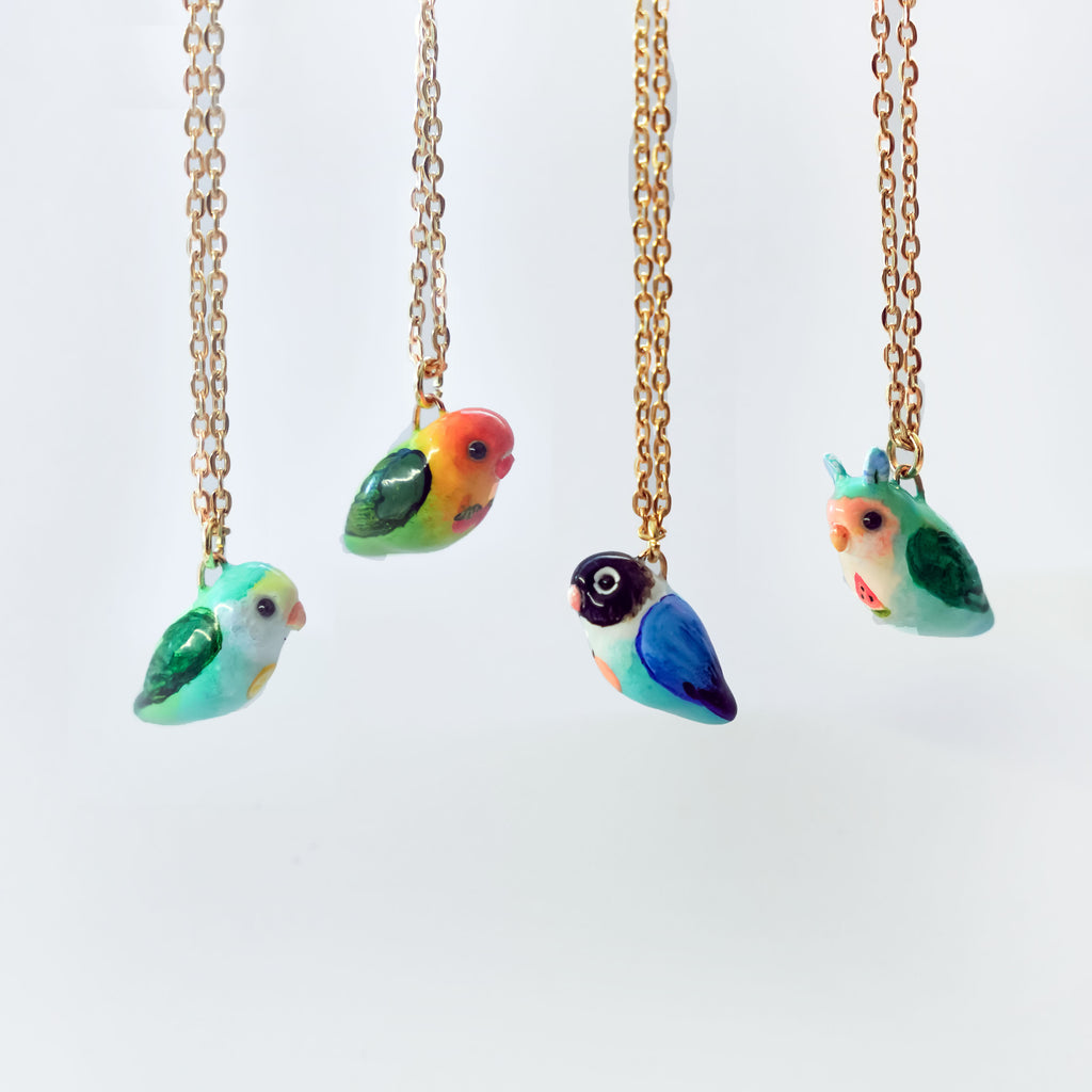 Lovebird with fruit pendant