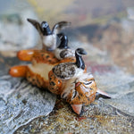 Lynx with canadian geese figurine