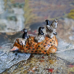 Lynx with canadian geese figurine