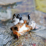 Lynx with canadian geese figurine