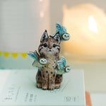 Lynx with barn owls figurine
