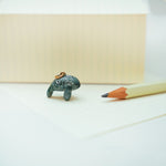 Manatee with a lace pendant