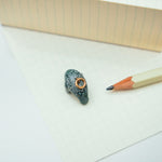 Manatee with a lace pendant